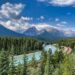 A scenic mountain landscape with a winding river, symbolizing the journey of building self-trust, personal growth, and moving forward with confidence.