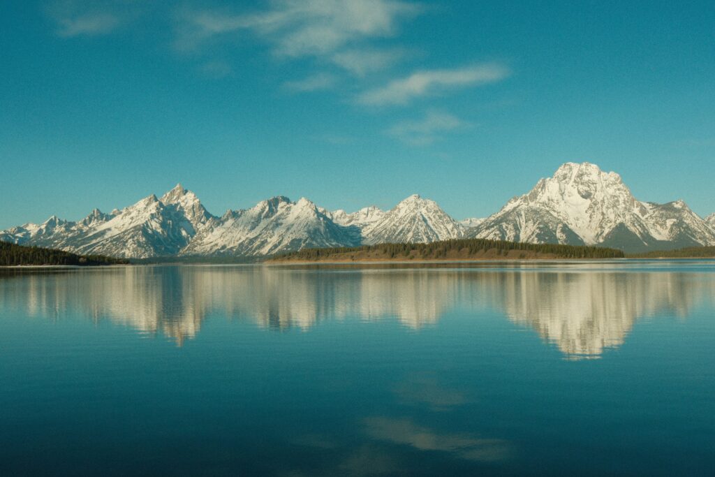 Calm mountain lake representing grounding and self-reflection while healing from trauma and hypervigilance