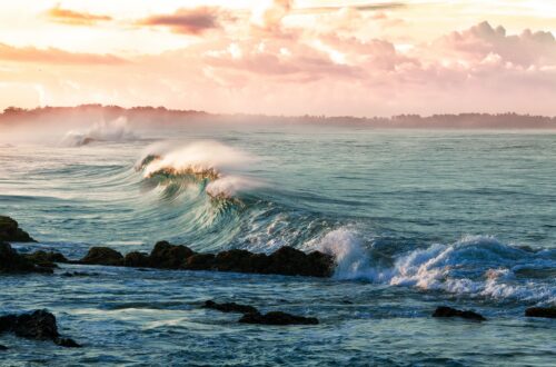 Powerful ocean wave breaking in the sea, symbolizing emotional boundaries and letting go of what isn't yours to carry