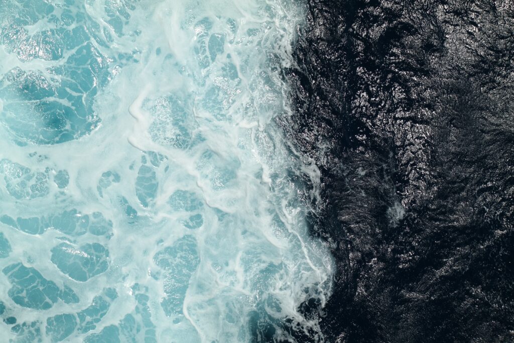 Two contrasting bodies of water meeting, symbolizing healthy boundaries and remaining grounded in yourself