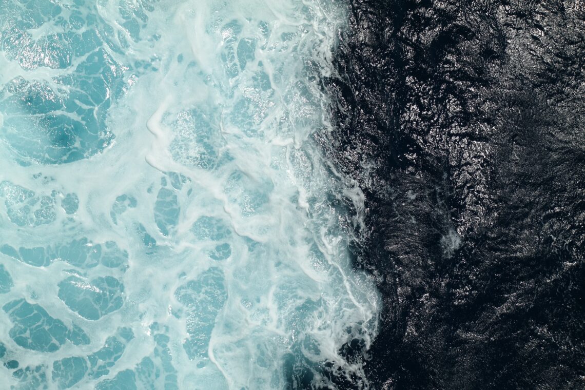 Two contrasting bodies of water meeting, symbolizing healthy boundaries and remaining grounded in yourself