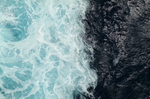 Two contrasting bodies of water meeting, symbolizing healthy boundaries and remaining grounded in yourself